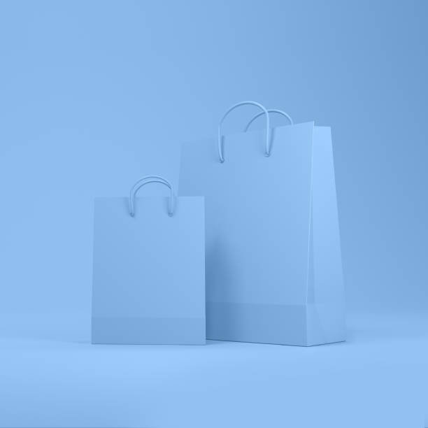 istock Shopping bags in blue background with space for text or design. 1330741659