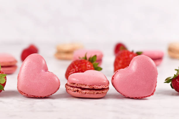 istock Pink heart shaped French macaron sweets 1330743338