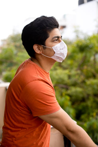 istock Young man wears a mask to protect against viruses 1330746102