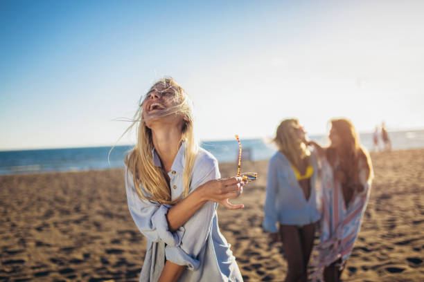 Three beautiful girls having fun on the beach