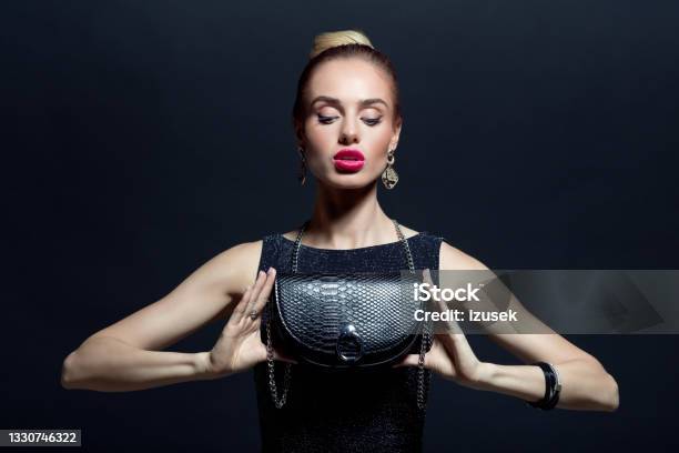 Portrait Of Elegant Woman Holding Evening Bag Stock Photo - Download Image Now - Evening Gown, 20-29 Years, Adult