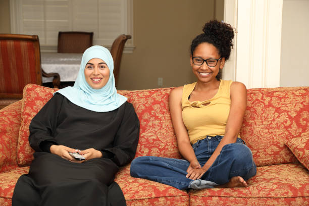 istock Middle Eastern Woman and Friend Have Fun Watching TV 1330746352