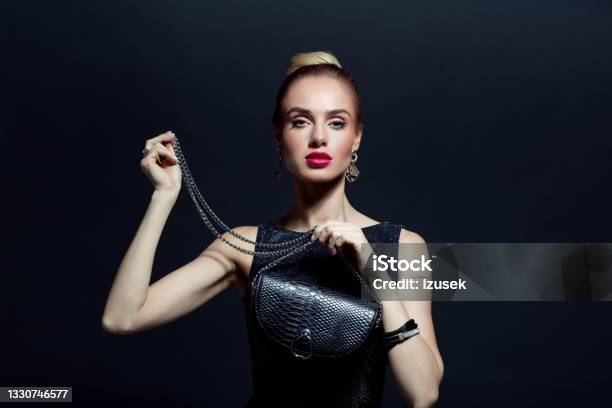 Portrait Of Elegant Woman Holding Evening Bag Stock Photo - Download Image Now - 20-29 Years, Adult, Adults Only