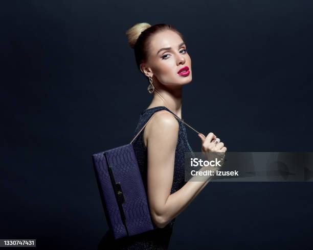 Portrait Of Elegant Woman Holding Hand Bag Stock Photo - Download Image Now - Evening Bag, High Society, Shopping