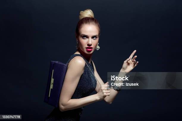 Portrait Of Elegant Woman Holding Hand Bag Stock Photo - Download Image Now - Luxury, One Woman Only, Women