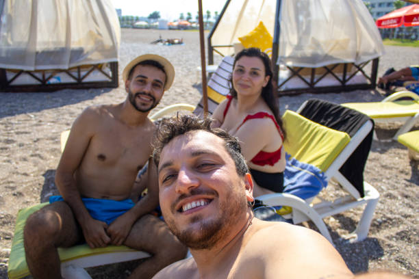 istock friends who took selfies on the beach 1330748594