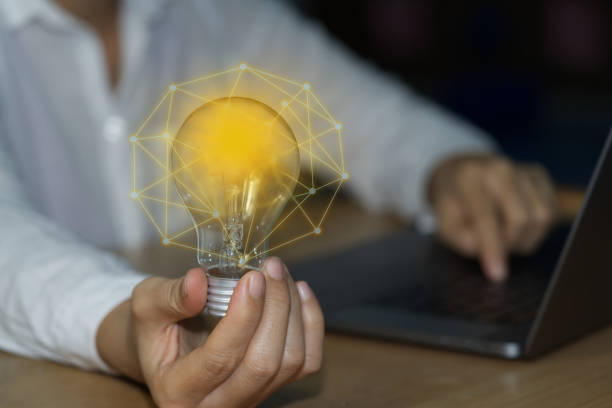istock Concept ideas and light bulbs with connecting wires. Business people show new ideas by using innovative technology and creativity. 1330749096