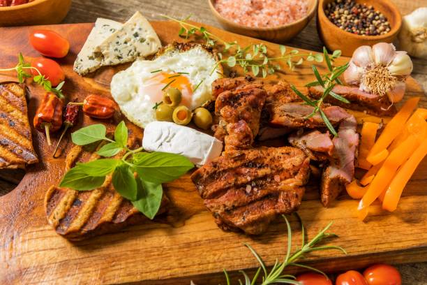 istock Grilled meat with fried egg and cheese. Summer barbecue. Fat meal. 1330749120