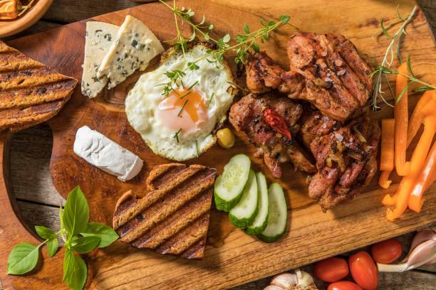 istock Grilled meat with fried egg and cheese. Summer barbecue. Fat meal. 1330749173