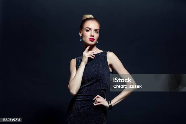 Portrait Of Elegant Woman On Back Background Stock Photo - Download Image Now - Black Color, Beautiful Woman, Dress