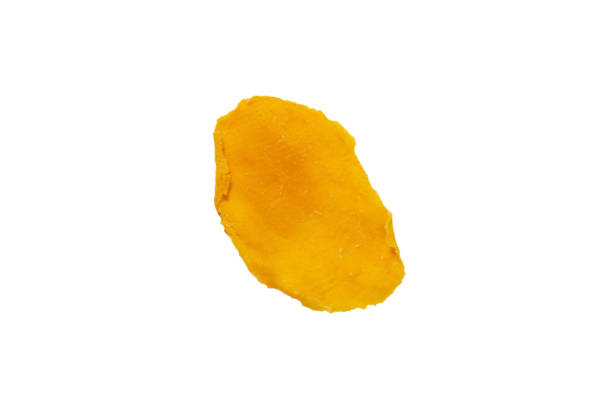 istock Dry tasty mango slices isolated on a white background. 1330749805