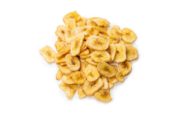 istock Banana chips isolated on a white background. Dehydrated banana. 1330749811