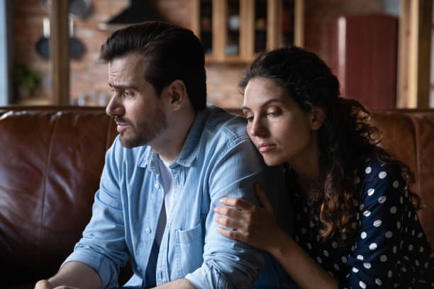 istock Wife expressing empathy and compassion to sad frustrated husband 1330749997