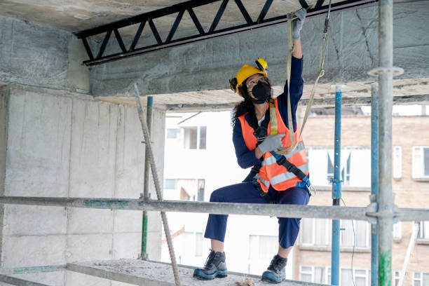 istock Afro woolly woman, a construction worker, uses all means of protection while working as a worker 1330750187