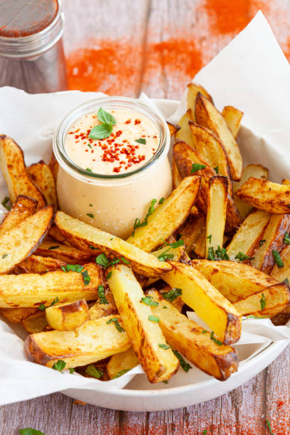 Homemade French fries, potato wedges stock photo