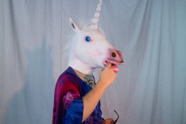istock Unicorn Mask Head Glasses Hippy Model Tie-Dye Psychedelic Mad Halloween Model 1330751009