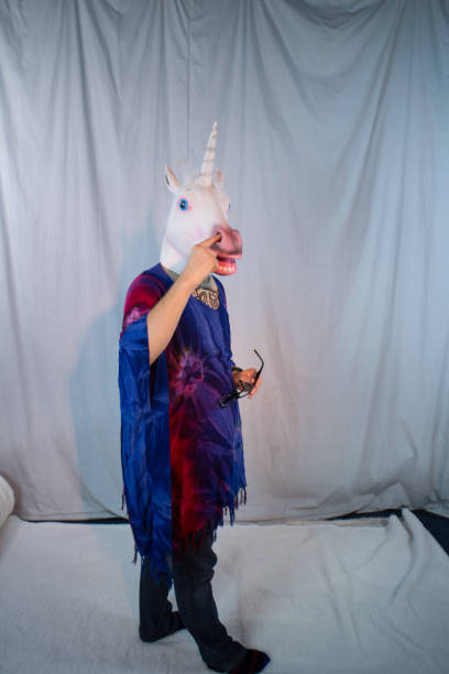 istock Unicorn Mask Head Glasses Hippy Model Tie-Dye Psychedelic Mad Halloween Model 1330751040