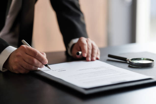 istock Businessman Signing Contract In The Office 1330751091