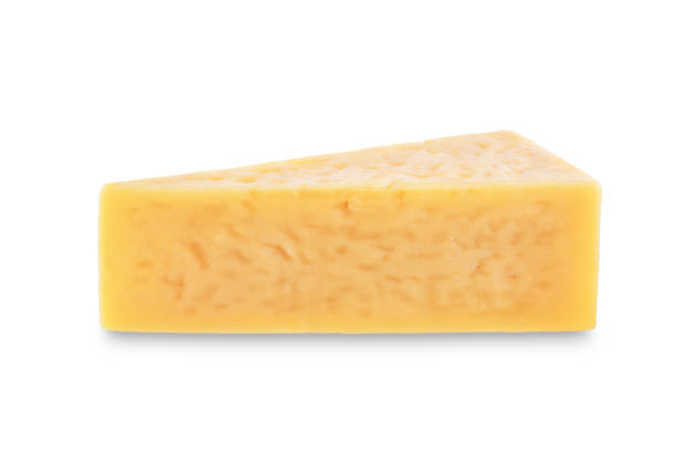 istock Parmesan cheese slice on a white isolated background 1330751116