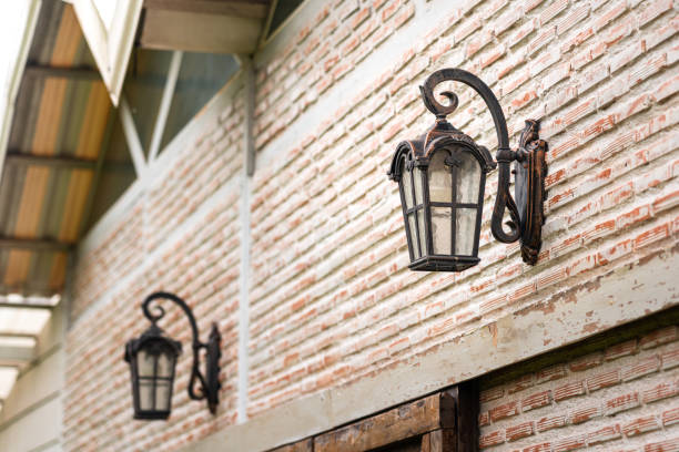 istock An antique designed street lighting lamp on brick wall. 1330751271