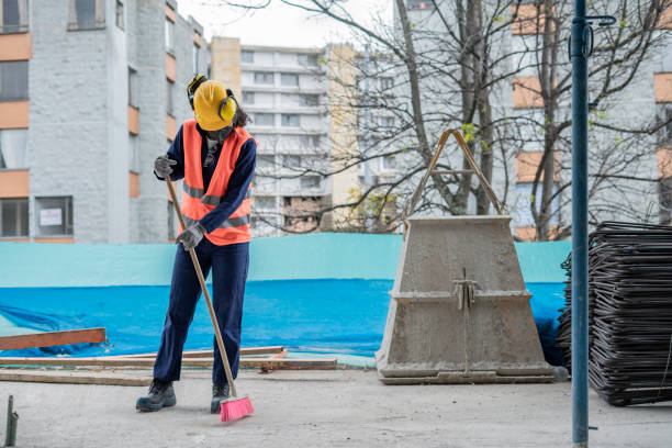 istock Afro Latina Woman Construction Worker Sweeps Workplace 1330751296