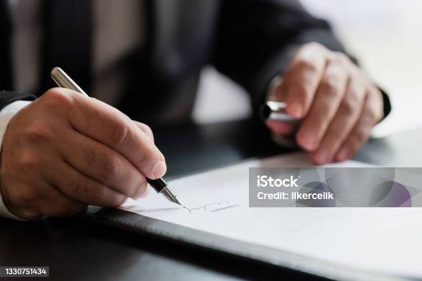 Businessman Signing Contract In The Office Stock Photo - Download Image Now - Lawyer, Signing, Document