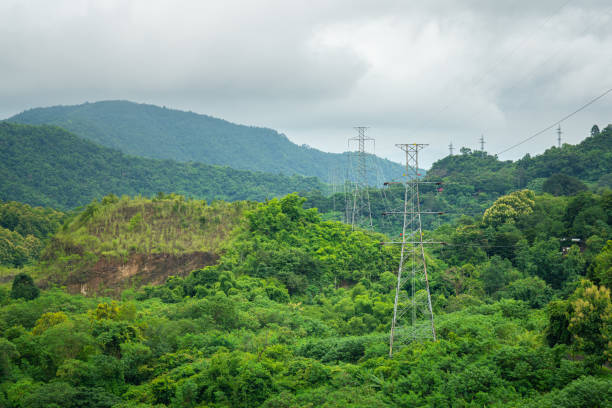 istock High voltage electricity tower passing the highland rural environment. 1330751450