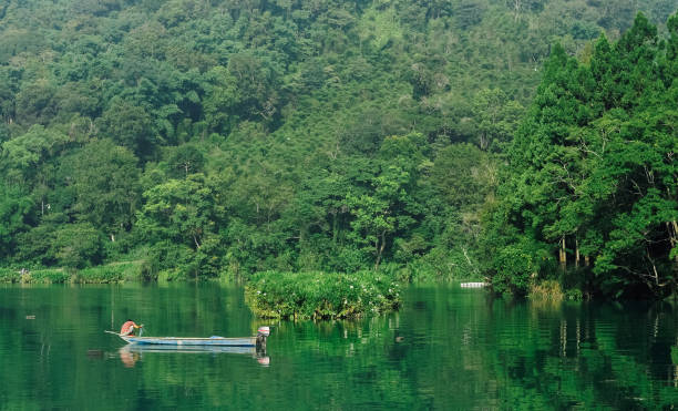 istock Fisherman in the lake 1330752442