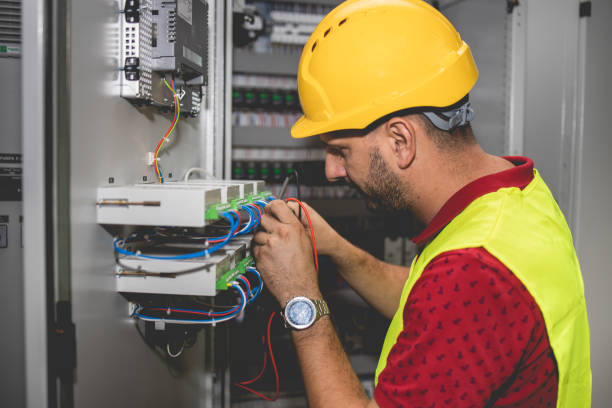 istock Electrician engineer work tester measuring voltage and current of power electric line in electical cabinet control. 1330756852
