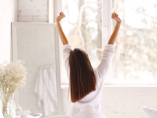 istock Unrecognizable female waking up in morning 1330758368