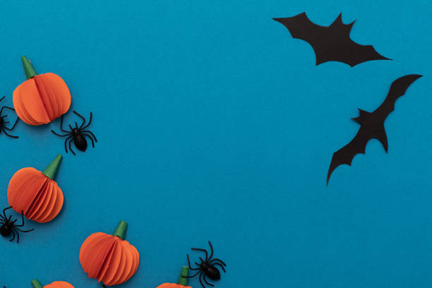 istock Modern black and orange invitation card on blue background. Halloween concept 1330758382