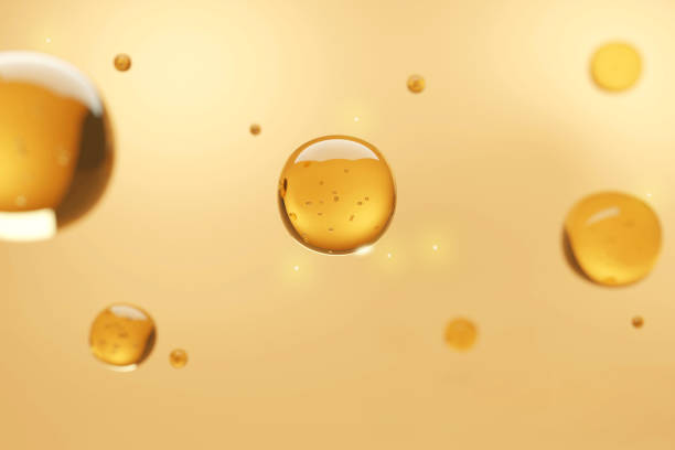 istock Vitamin Serum for skin with orange background 1330758583
