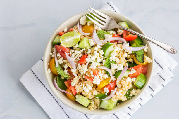 istock Bulgur Wheat Salad with Vegetables on White Background Top Down Photo 1330759633