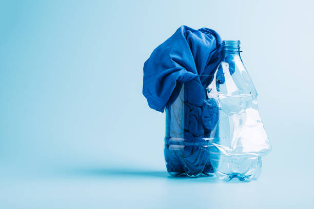 istock Polyester fiber synthetic fabrics eco-friendly textile recycled recyclable plastic bottles. Reuse recycling used bottles 1330760149