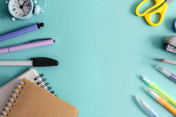 istock concept back to school creative top view. School and office supplies on a light blue paper background. Copy space, template for text or design. 1330762211