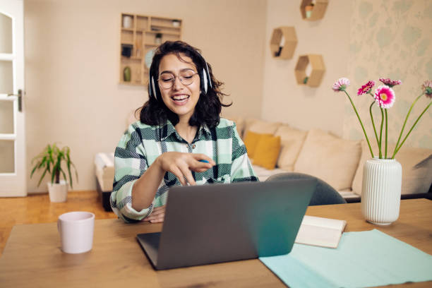 istock Girl having an online class at her home office 1330762651