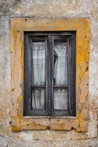 istock Old window in abandoned rural house with wooden frame 1330763447