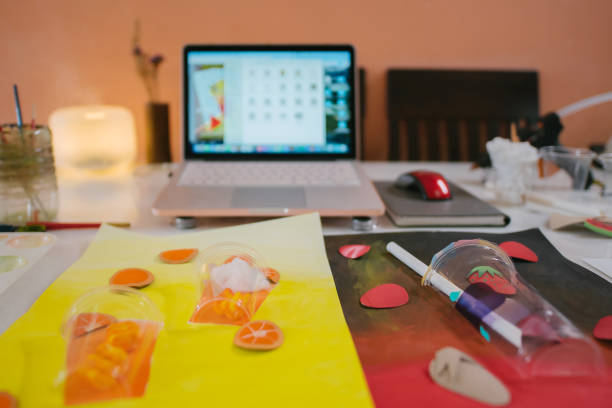 istock Video conference laptop and art tools preparing on desk during online art class in home 1330763466