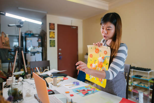 istock Asian chinese female teacher teaching online art class at home 1330763510