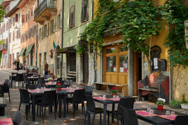 Trento city in the district Alto Adige the twenty second of July 2021.  Piazza di Piedicastello. Incidental people outdoors during a hot period. Images from Northern Italy / Trento