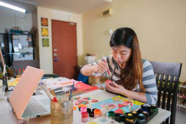 istock Asian chinese female teacher teaching online art class at home 1330763546