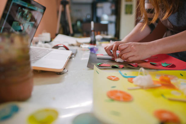 istock Asian chinese female teacher teaching online art class at home 1330763559