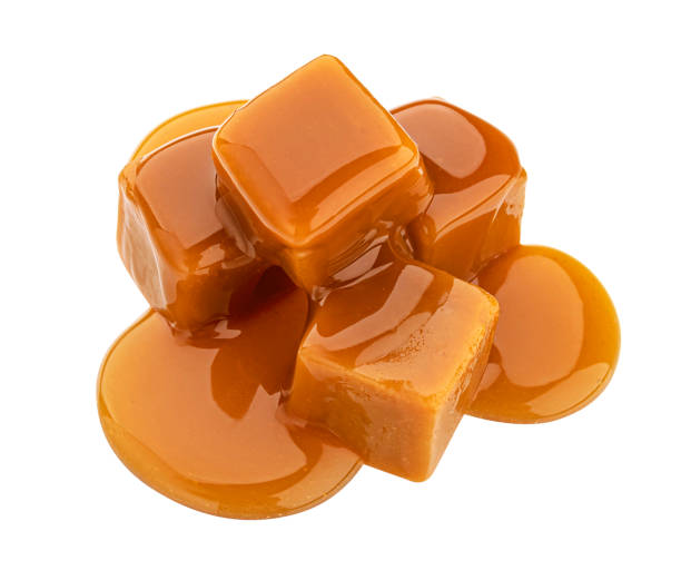 istock Caramel candy and caramel sauce isolated on white background 1330764924
