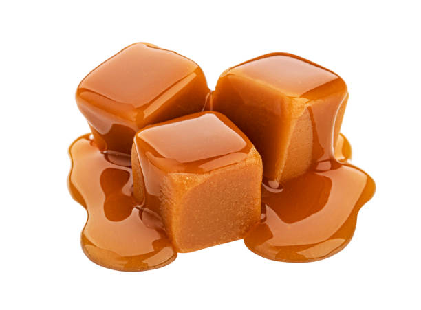 istock Caramel candy and caramel sauce isolated on white background 1330764928