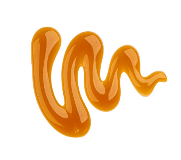 istock Caramel sauce isolated on white background, top view 1330764964