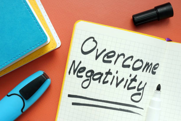 istock Overcome negativity handwritten memo on the page and marker. 1330765683