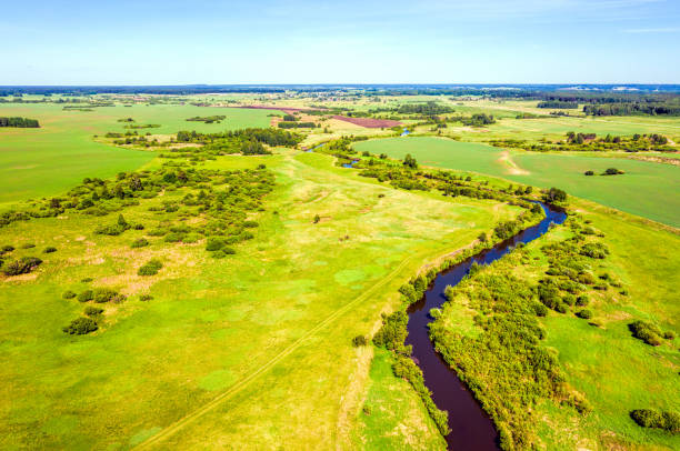 istock Aerial view of the winding river and summer fields with trees 1330768306