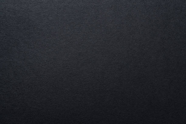istock Black paper textured background, close up. 1330768661