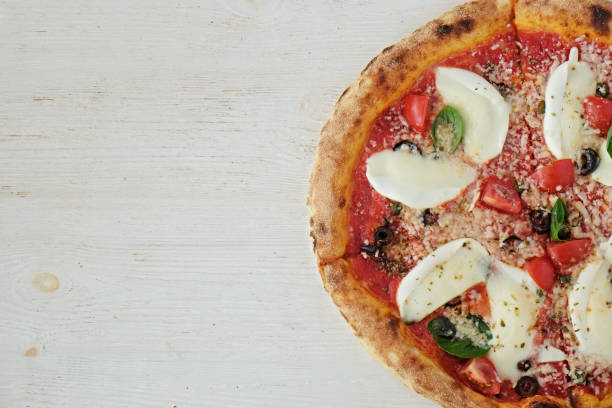 istock Pizza with large pieces of mozzarella 1330770119