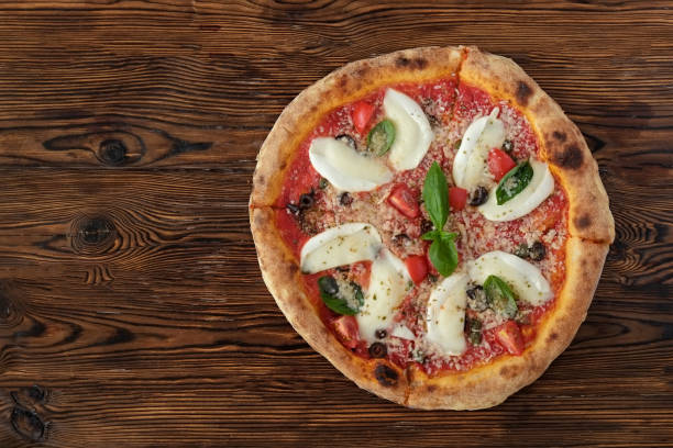 istock Pizza with large pieces of mozzarella 1330770160
